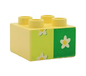 Duplo Light Yellow Brick 2 x 2 with white flower on green (3437 / 31460)