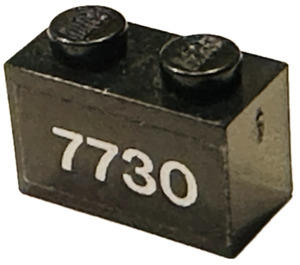 LEGO Black Brick 1 x 2 with '7730' Sticker with Bottom Tube (3004)