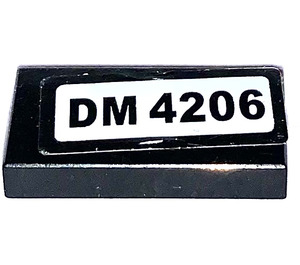 LEGO Black Tile 1 x 2 with 'DM 4206' Sticker with Groove (3069)