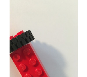 LEGO Red Narrow Tire 24 x 7 with Ridges Inside with Brick 2 x 4 Wheels Holder with Red Freestyle Wheels Assembly