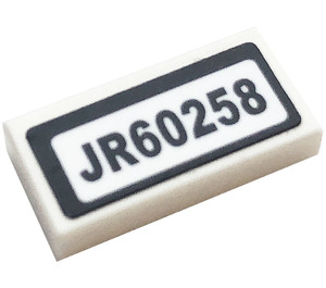 LEGO White Tile 1 x 2 with 'JR60258' Sticker with Groove (3069)