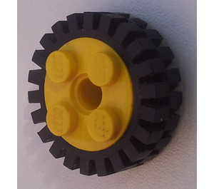 LEGO Yellow Wheel Rim 10 x 17.4 with 4 Studs and Technic Peghole with Narrow Tire 24 x 7 with Ridges Inside