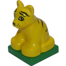 Duplo Yellow Tiger Cub sitting on green base