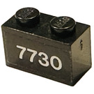 LEGO Black Brick 1 x 2 with '7730' Sticker with Bottom Tube (3004)