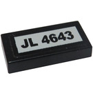 LEGO Black Tile 1 x 2 with 'JL 4643' Sticker with Groove (3069)
