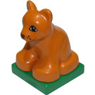 LEGO Duplo Earth Orange Lion Cub sitting on green base