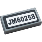 LEGO Medium Stone Gray Tile 1 x 2 with 'JM60258' Sticker with Groove (3069)