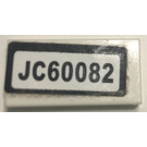LEGO White Tile 1 x 2 with "JC60082" Sticker with Groove (3069)
