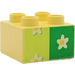 Duplo Light Yellow Brick 2 x 2 with white flower on green (42682 / 43946)