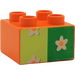 Duplo Orange Brick 2 x 2 with white flower on green (42682 / 43946)