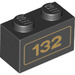 LEGO Black Brick 1 x 2 with Gold &#039;132&#039; Pattern with Bottom Tube (3004 / 19018)