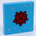 LEGO Medium Azure Tile 2 x 2 with Red Gift Bow and Silver Stars with Groove (3068)