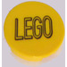 LEGO Yellow Tile 2 x 2 Round with Black &#039;LEGO&#039; Sticker with Bottom Stud Holder (14769)