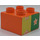 Duplo Orange Brick 2 x 2 with white flower on green (42682 / 43946)