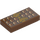 LEGO Reddish Brown Tile 1 x 2 with Chocolate Bar and Gold Bow with Groove (3069 / 25395)