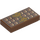 LEGO Reddish Brown Tile 1 x 2 with Chocolate Bar and Gold Bow with Groove (3069 / 25395)